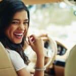 Woman enjoying her new car