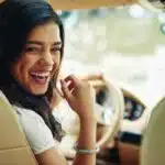 Woman enjoying her new car