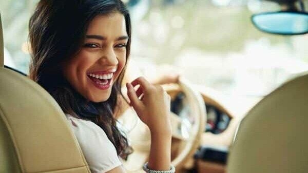 Woman enjoying her new car